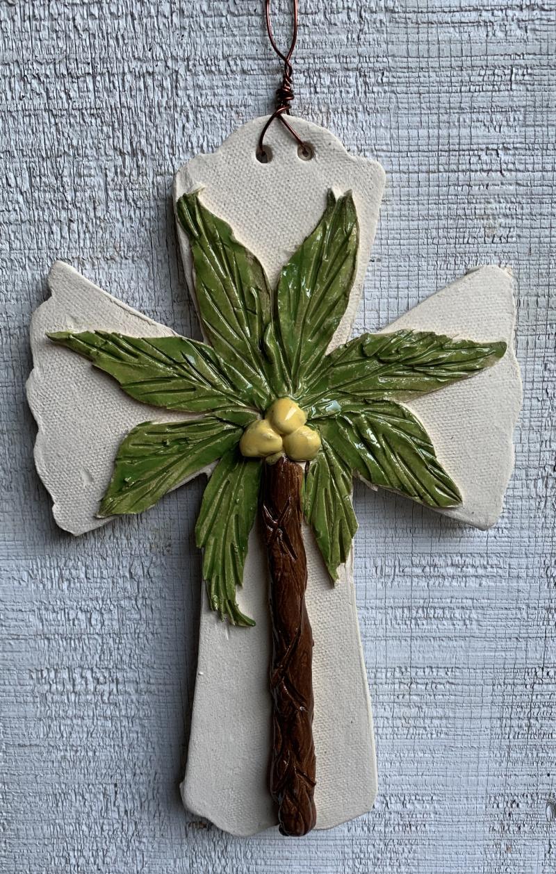 handmade hurricane cross with palm tree