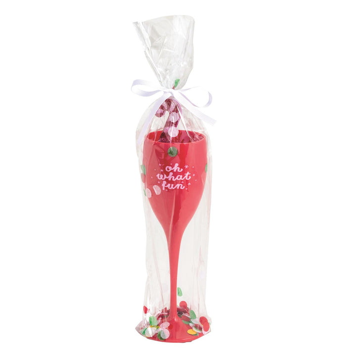 A red plastic champagne flute printed with &