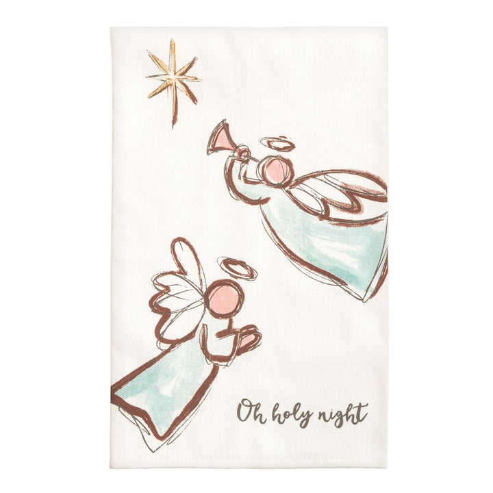 Two cream kitchen towels side by side: the left shows a watercolor nativity stable with a manger, two sheep wearing wreaths, evergreen garland, and the words &