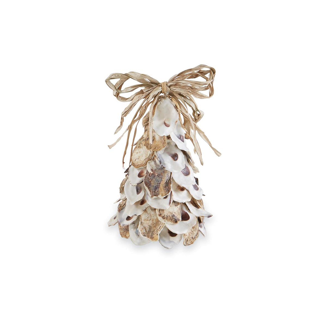 A cone-shaped decorative tree made from layered natural oyster shells in white, tan, and brown tones, topped with a tied raffia bow, displayed against a white background.