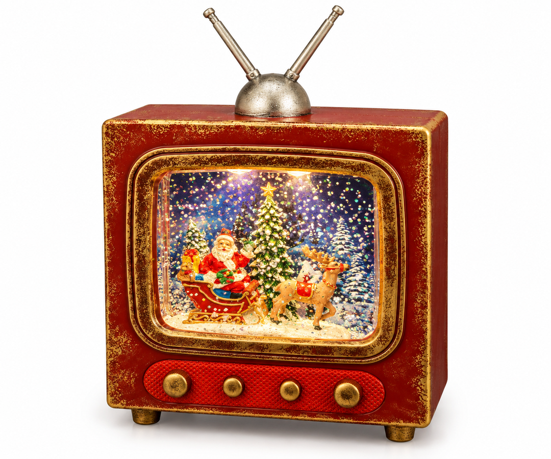 A distressed red and antique gold retro television-shaped water globe with a silver rabbit-ear antenna, featuring an illuminated interior scene of Santa in a sleigh with a reindeer and snow-covered Christmas trees, with multicolor glitter swirling in the liquid-filled screen area.