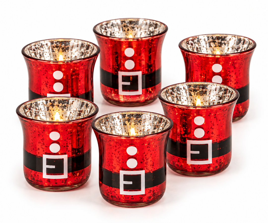 Six red mercury-glass votive candle holders arranged in a group, each displaying a painted black Santa belt with a white buckle and two white button dots, with lit tealight candles glowing inside.