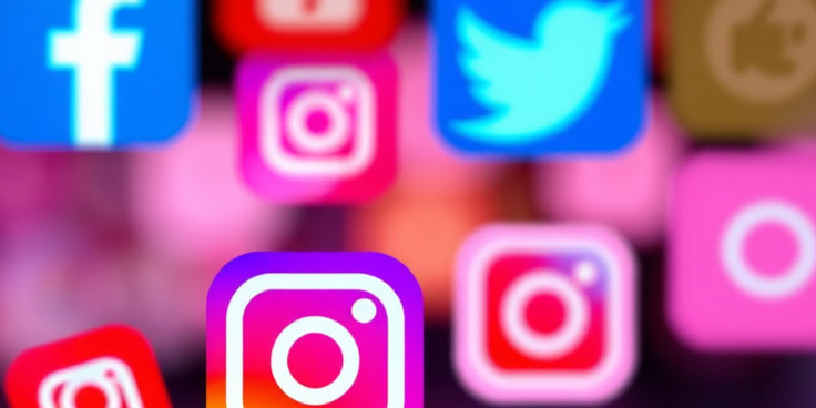 Various social media icons including Instagram, Facebook, and Twitter on a blurred background.